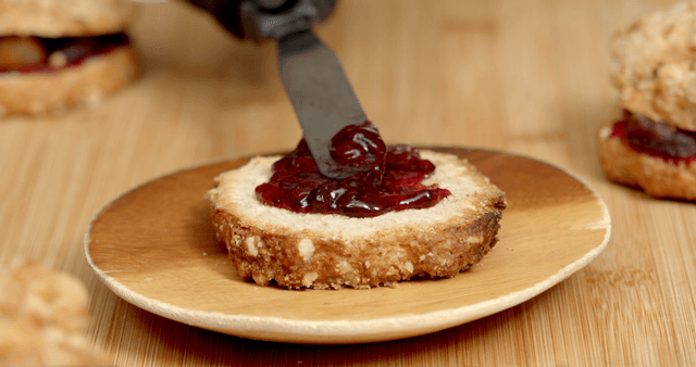 Strawberry jam spread on rustic bread