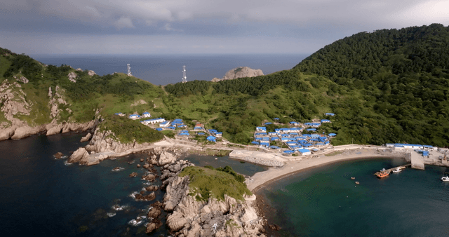 Coastal village with blue-roofed houses