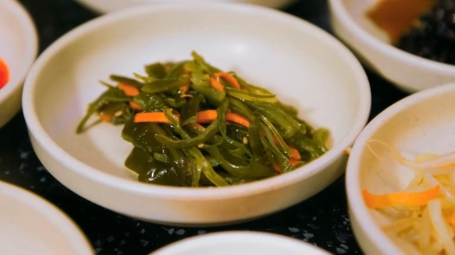 Korean side dishes in small bowls