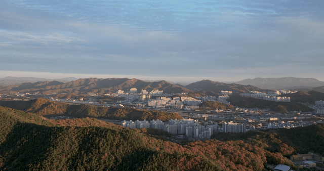 City surrounded by mountains at daybreak