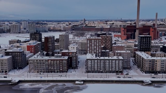 Snow-covered cityscape with modern buildings