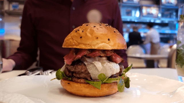 A gourmet burger served at a restaurant