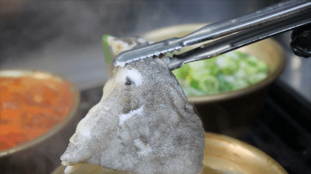 Cod soup boiling with vegetables