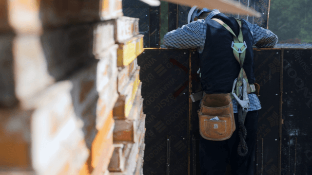 Construction worker handling materials