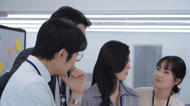 Office workers discussing a project