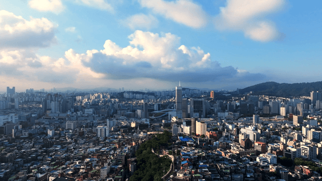 Sprawling cityscape under a blue sky