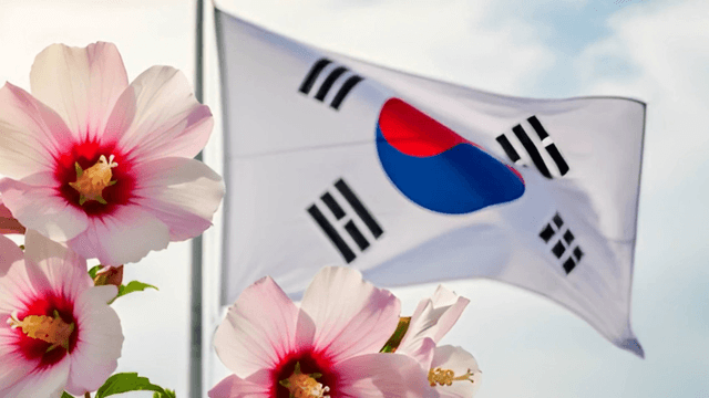 Korean flag waving with hibiscus flowers