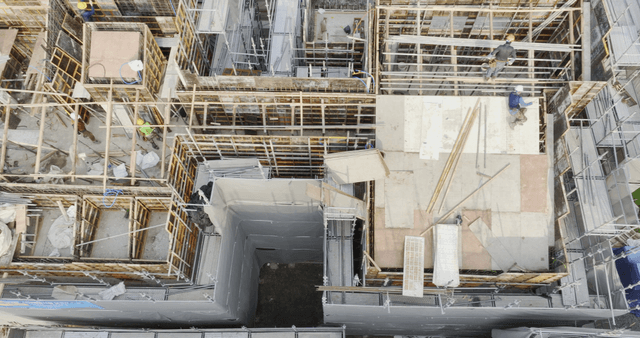 Construction site with workers and materials