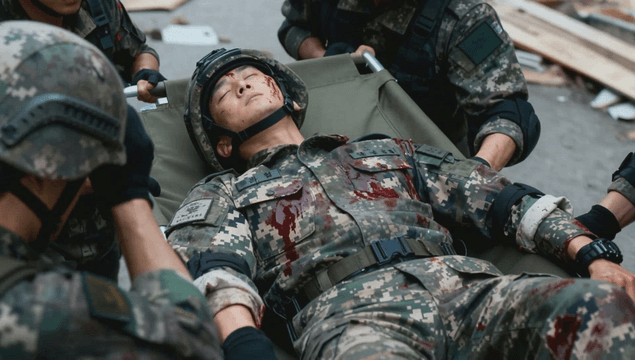 Soldiers carrying an injured comrade