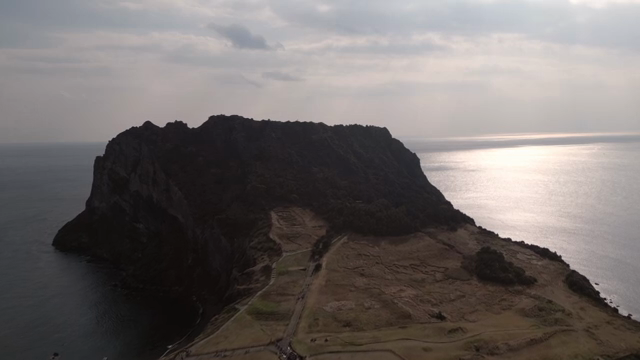 A scenic island with a rocky cliff