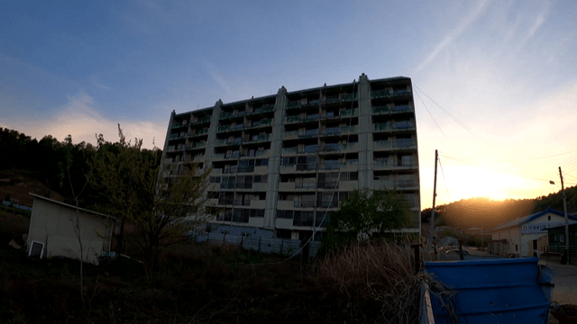 An apartment building at sunset