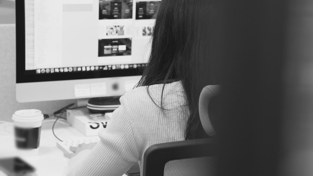 Person working at a computer in an office