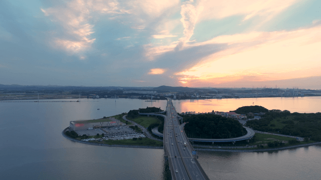 Bridge over a sea at sunset