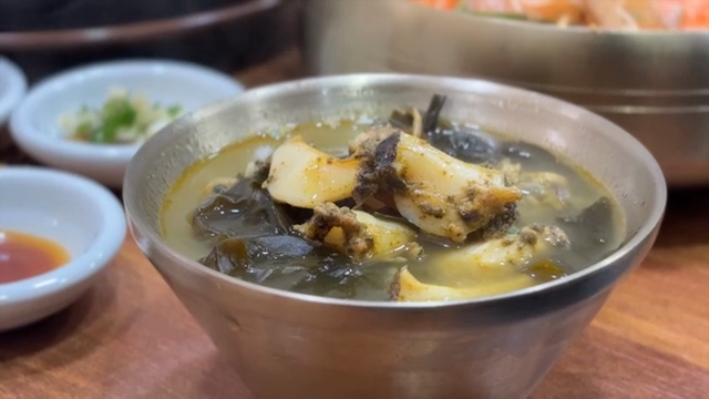 Abalone seaweed soup in a metal bowl
