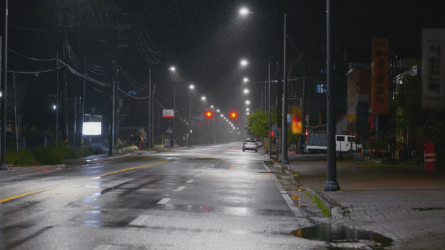 Empty city road in the rain