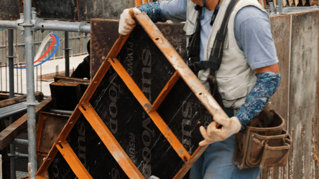 Construction worker handling materials