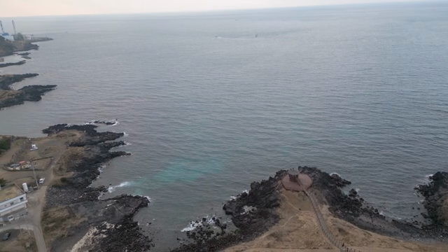 Coastal view with a pavilion and rocky shore