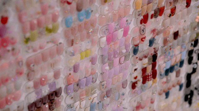 Variety of colorful nail designs on display