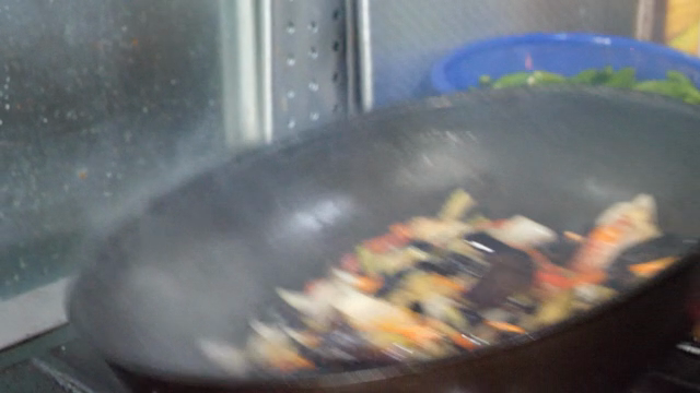 Vegetables being stir-fried in a pan