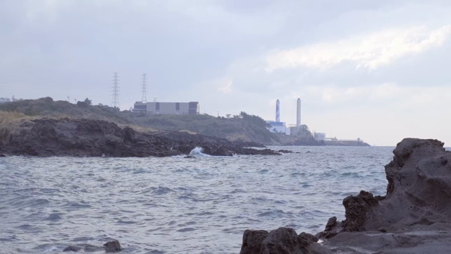 Coastal view with industrial buildings