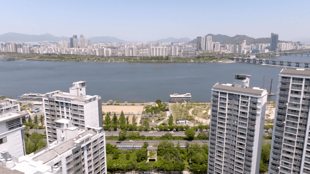 City skyline with river and park