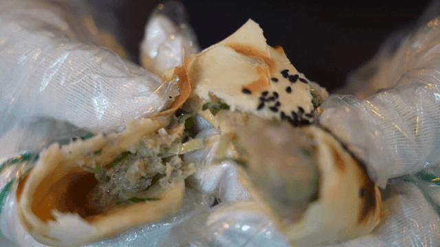 Fire oven dumpling with filled center being opened