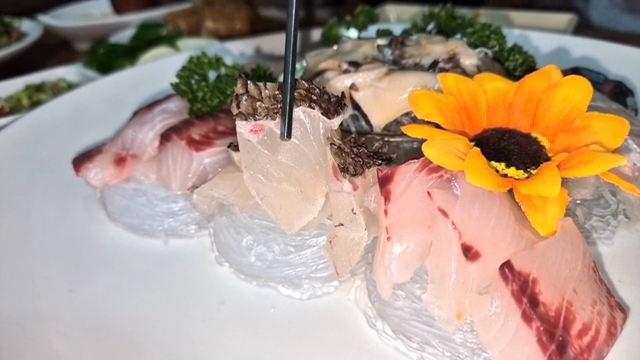 Fresh sashimi garnished with a flower
