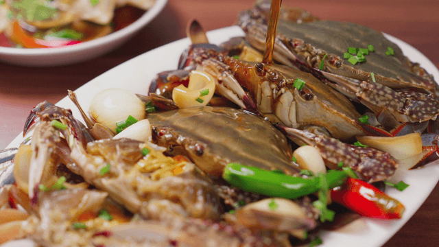 Soy sauce marinated crabs with vegetables