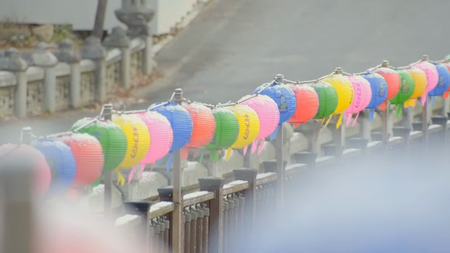 Colorful lanterns lined up on a snowy day