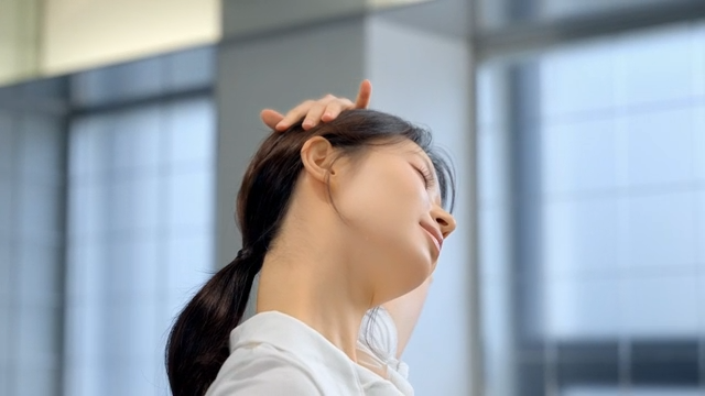 Young woman stretching indoors with focus