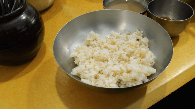Barley rice bowl on yellow table
