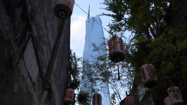 Skyscraper view through traditional lanterns