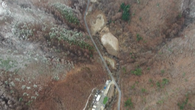 Snow-covered mountains and winding roads
