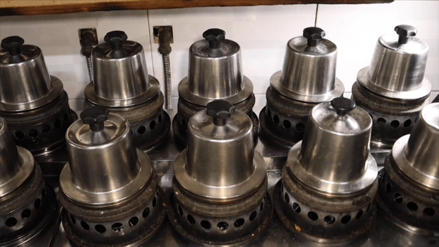 Multiple hot stone pots on the stove