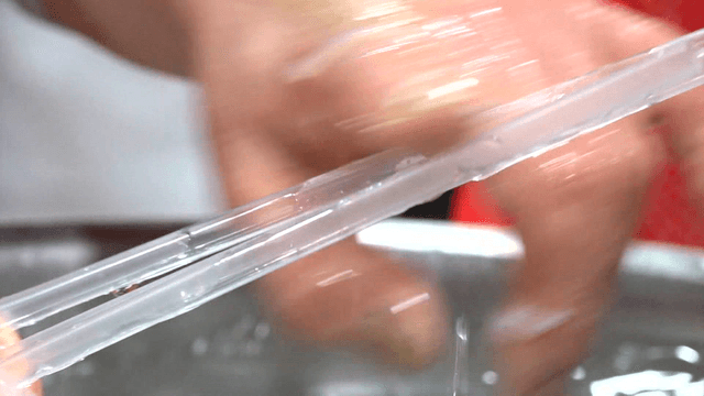 Strainer preparing ice fish in large basin