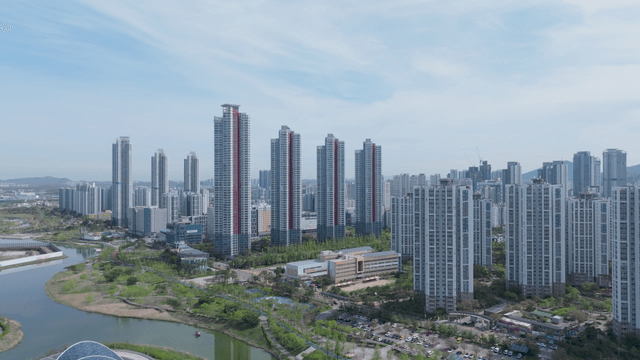 Modern city skyline beside lake park