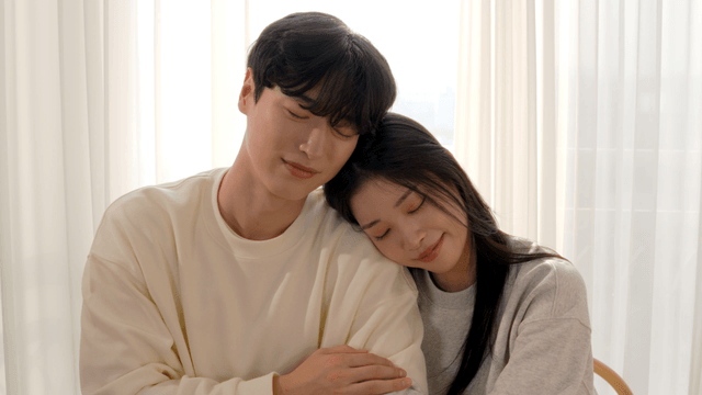 Couple resting by bright window side