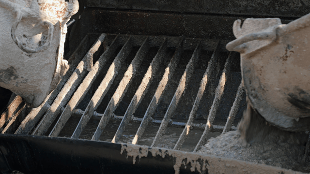Concrete pouring into a mixer