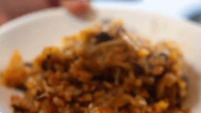 Kimchi fried rice being served in a bowl