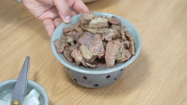 Korean Cold Buckwheat Noodles and grilled meat on a table