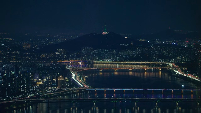 Night view of a city with illuminated bridges