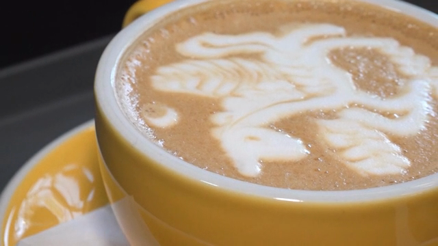 Latte art with a unicorn design in a cup
