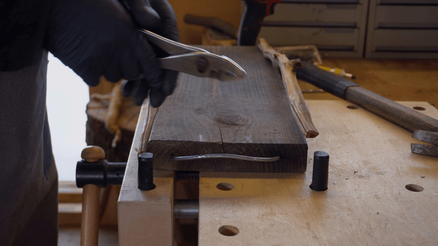 Craftsman working on a wooden board