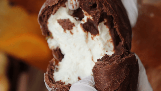 Cream-filled bread being torn open
