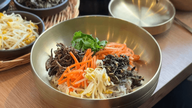 Colorful bibimbap ingredients in a bowl