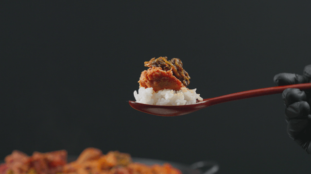 Boneless pork from stew on spoonful of rice