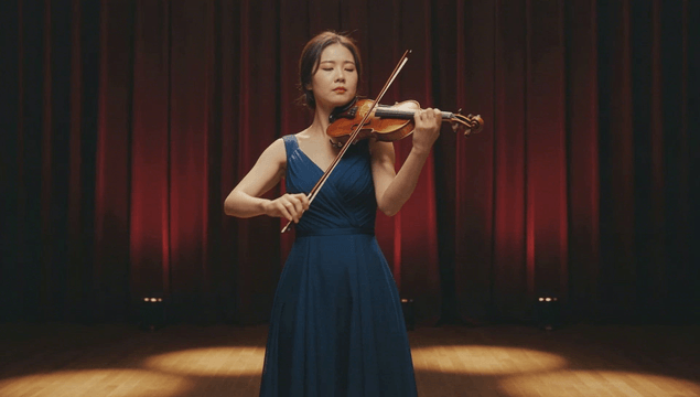 Violinist performing on stage