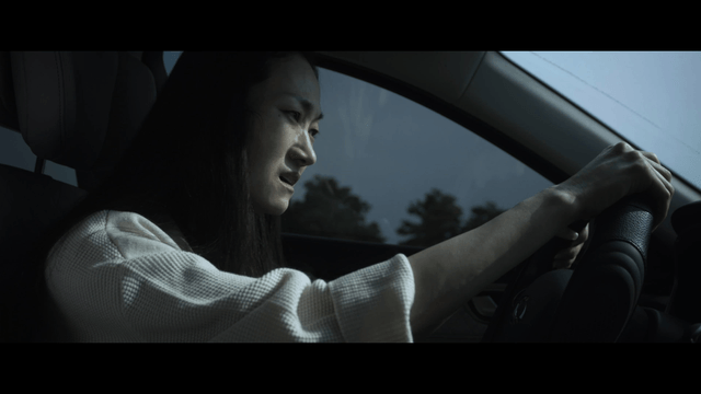 Woman crying while driving