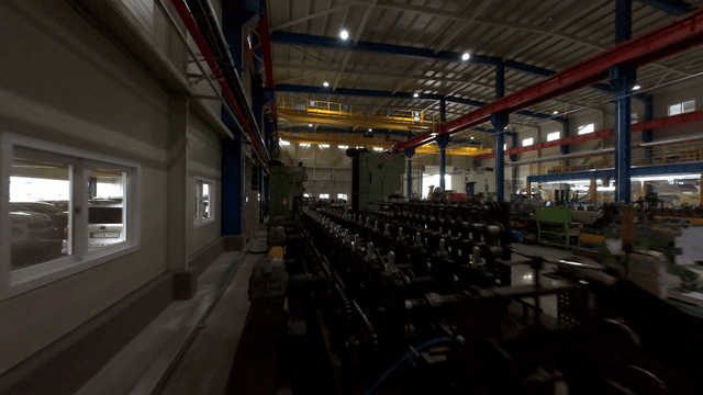 large factory with metal coils and machinery