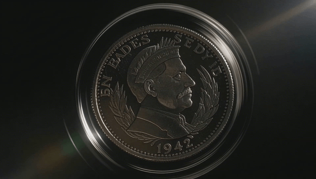 Spinning coin with an intricate portrait engraving